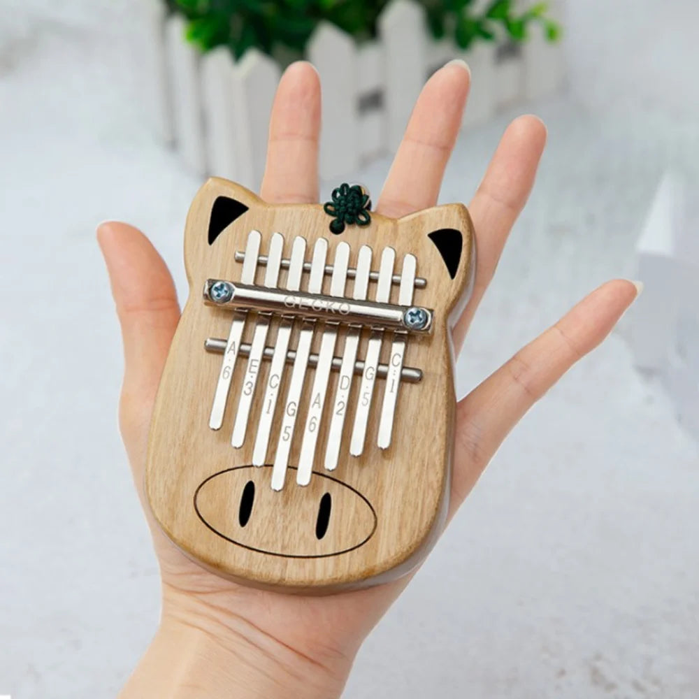 Musician playing a melodious tune on an 8-key kalimba.