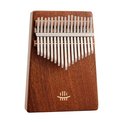 Portable thumb piano with carved top