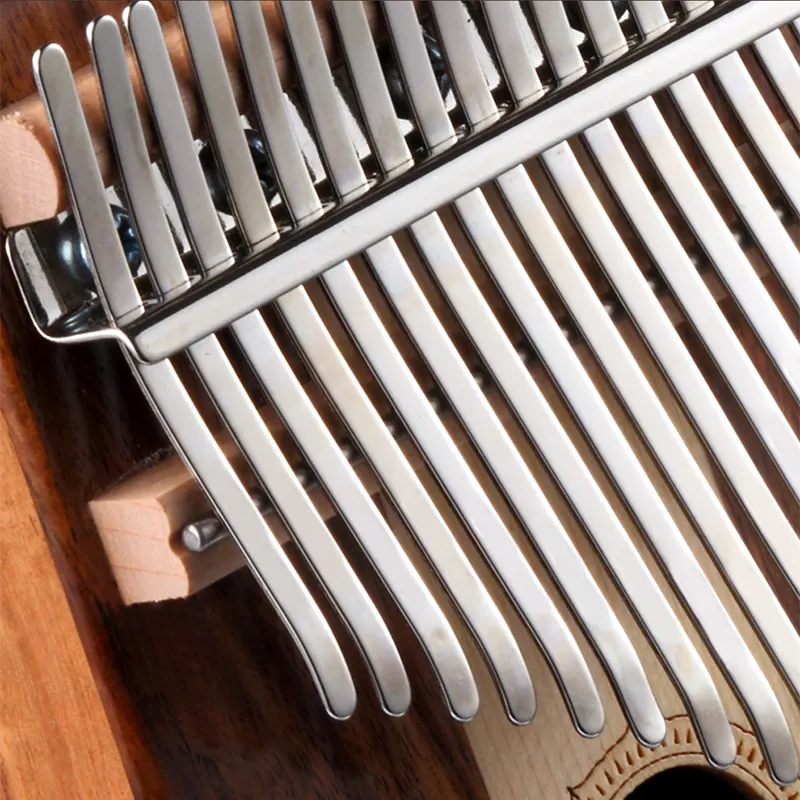 Demonstrating finger techniques for playing kalimba.