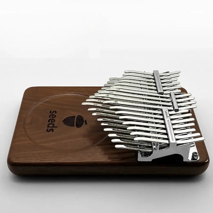 Detailed view of engraved notes on the 34 keys of a Seeds Chromatic kalimba.