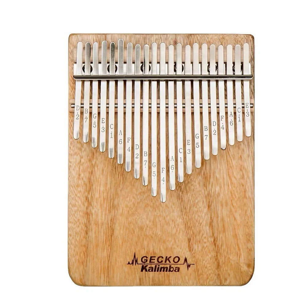 Gecko 21 key kalimba captured in a serene outdoor setting, blending with nature.